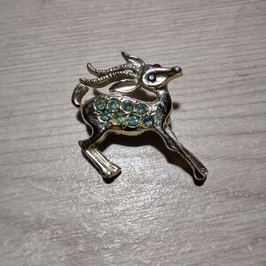Elegant Gold and Green Reindeer Brooch